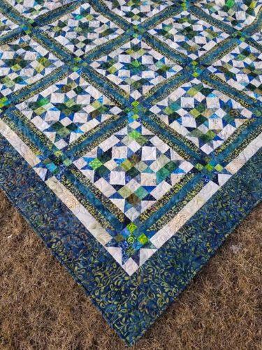I attribute two factors in this quilt coming about 1- My friend Connie said she was thinking about making Scrap Crystals all in batiks. I loved the idea but had no batiks.