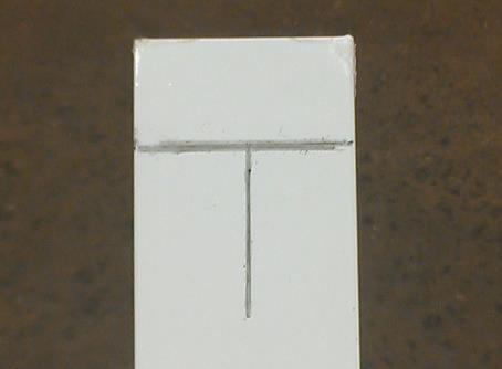 Align the top of the post bracket with the top of the T and center the post bracket screw hole with the center of the T.