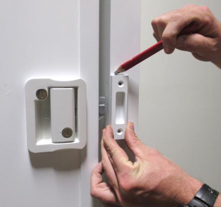 Secure to the door by using the four ¾ stainless steel screws provided.