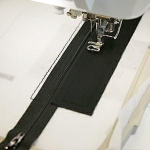 Then continue to embroider the "top front piece tackdown" step.