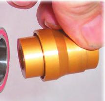 21) Place the bearing, shimside down, on