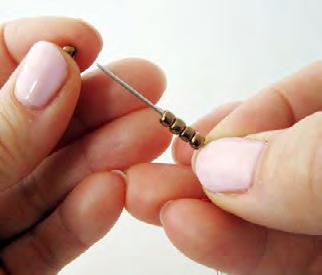 Threading beads onto yarn The size needle you would usually use to sew a knitting yarn will be far too large to thread