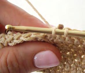 Note You can choose to place the bead on the second step of the double crochet stitch once you have