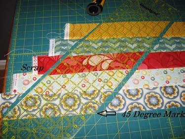 Strip piece the entire strips together into a set of 5 but staggering the strips by appx. 2" to form upward steps.