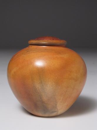 212R Buttery round lidded vessel in bright burnt orange, horsehair lines and feather carbon painting, soft variations and