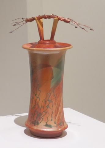 $90 308 Lidded Jar with copper pipe, wire and black pearls finial, earthy red, orange and blue-green brush strokes and glaze trailing on finely crackled white glaze then fumed for overall