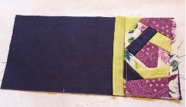 29. Fold the 6 x 2 strip in half lengthwise, wrong sides together to create a binding for the crazy patch pocket. 30.