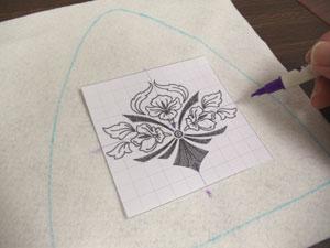 Remove the pattern and create a paper template of the design by printing it at full size using embroidery software.