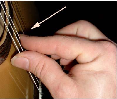 Playing Notes Start by using your thumb andpluck the 6th string (the one closest to your chest) without using your fretting hand at all. This will produce an E note.