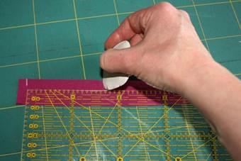 1. Place your pattern on the fabric and weight it