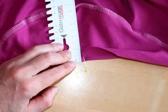 5. Pin sleeves right sides together to armhole and sew. Side seam is still open. Sleeve hem: fold in ¾ (2cm) and sew from right side with the twin needle.