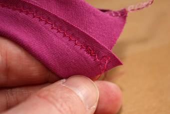 (Please read the manual of your sewing machine first, with some machines it is not possible to alter the tension of the bobbin thread). Test it on a small piece of fabric first.