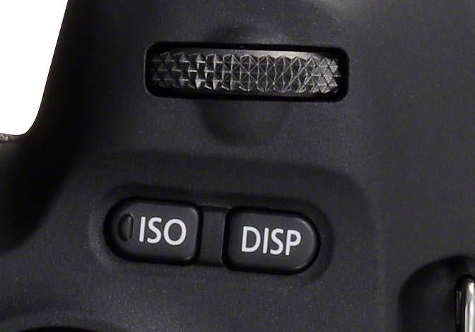 On the top of the camera there is a button marked as DISP. This toggles when pressed between the rear display being on and off.
