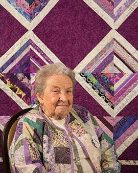 She prefers to make wallhangings and tablerunners over large quilts. Her background is one of her favorite wallhangings.