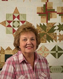 She has always matched fabric to a pattern, but her background quilt is the first time she varied from the