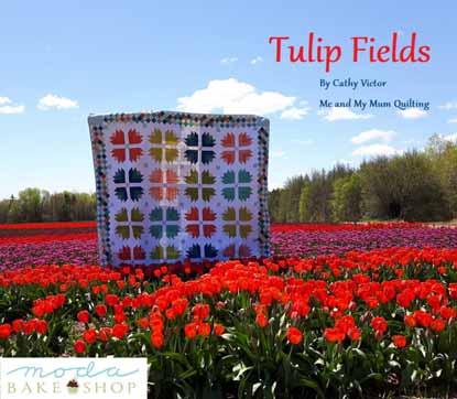 This quilt was inspired by the gorgeous Vanco Farms tulip fields, and I was lucky enough to have my quilt finished in time to photograph it while the tulips were still in bloom.