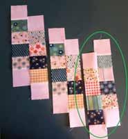 2. Sew the 2 1/2" x 2 3/4" background pieces to both ends of each segment like the photo