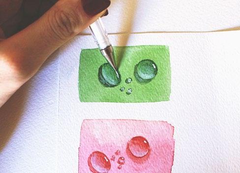 Step 6: Using a white gel pen or white acrylic, paint the whitest spot on the drop to represent
