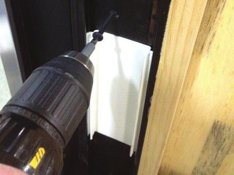 Prior to attaching the head to rough opening, square the door frame to within 1/8 3/16 tolerance. Use a tape measure to measure diagonally from corner to corner.