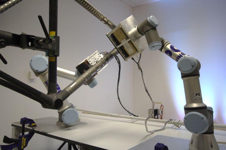 Fig.5 Robots inspecting a high-performance bike frame for defects.