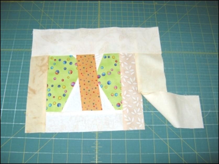 Now you are ready to sew the second strip to the block.
