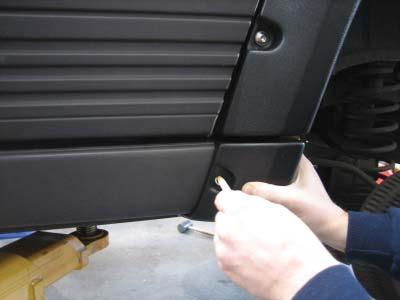Once all screws have been started, snug screws to vehicle.