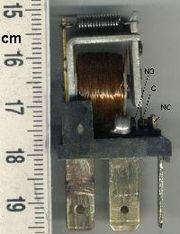 The switch is operated by an electromagnet to open or