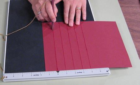 Begin the covers by scoring the cardstock to make a decorative debossed grid.