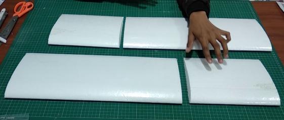 Laminate the Wing Panels Measure and cut the supplied adhesive backed laminate sheet to fit.
