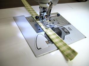 Sew a 1/8 inch seam along both sides of the long edges on each loop.