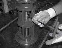 A flat screwdriver may be needed to spread collet while sliding.