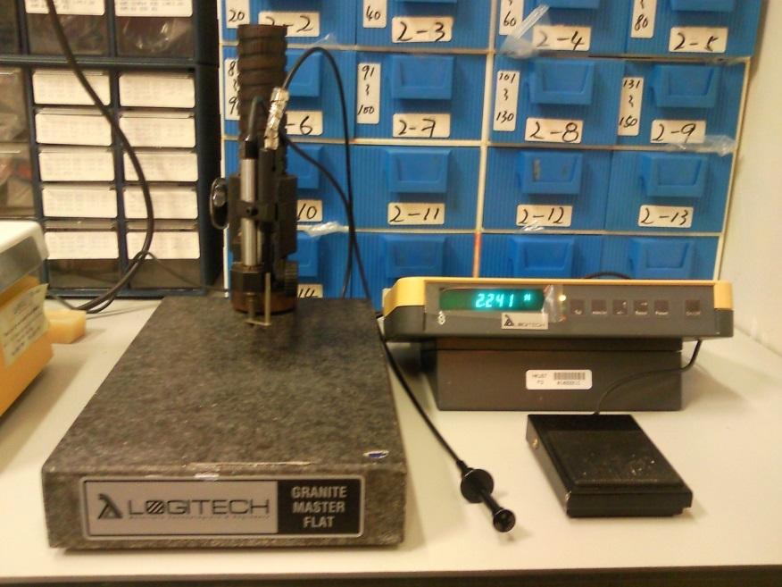 be broken. 9) Measure the thickness or flatness using dial gauge, shown in Fig. 8. Probe ON/OFF Digital display Reset button Granite master flat Fig.