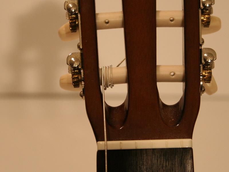 As the string winds around the tuning peg, make sure that the string passes over the loose