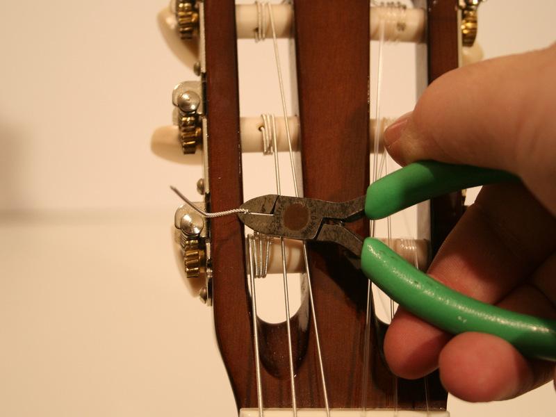 Step 8 Clip the loose ends Once you have tuned your guitar, remove the loose ends