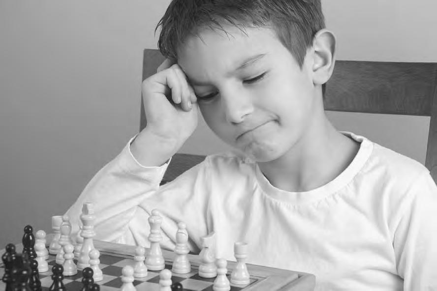 P r o d i g y In the poem, Simic describes bending over a chessboard as a boy. (Image copyright Sakala, 2010. Used under license from Shutterstock.