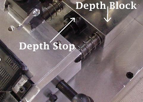 make a cut. Turn the spacing crank to.180 and make another cut. If we were using the.066 slotter widening would not be necessary. Rotate the spacing dial to.222, set the depth to.