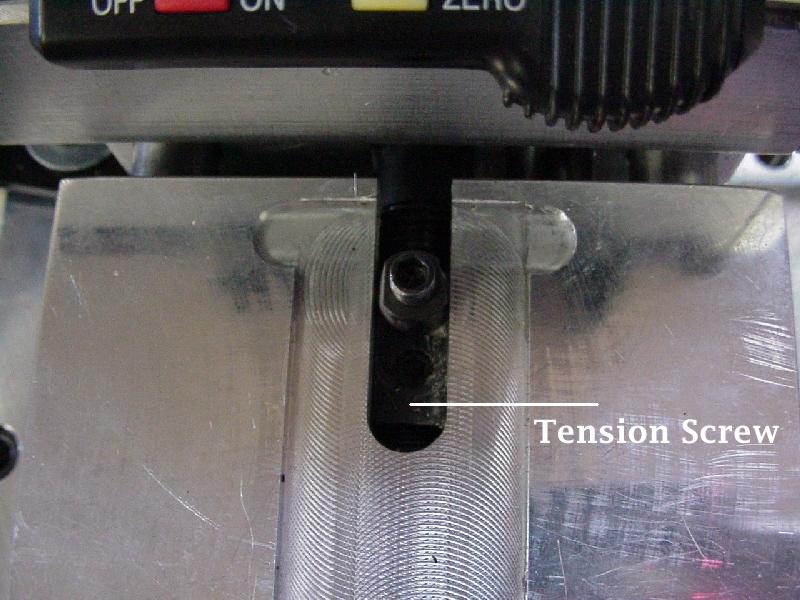 You will see two screws underneath (see figure 2 below) 3. Tighten or loosen the tension screw based on your preference. 4. Replace the readout.