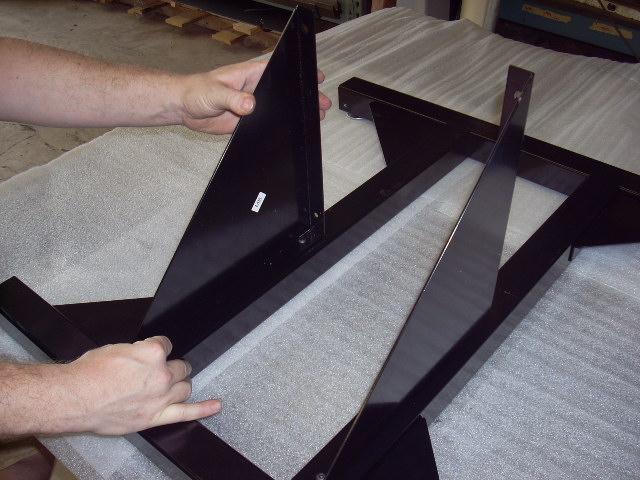 5. Flip the base assembly over. Locate the (4) ¼ tapped holes on the top of the center tubes. Attach the (2) mast braces (MB) with (4) ¼-20 x ½ screws.
