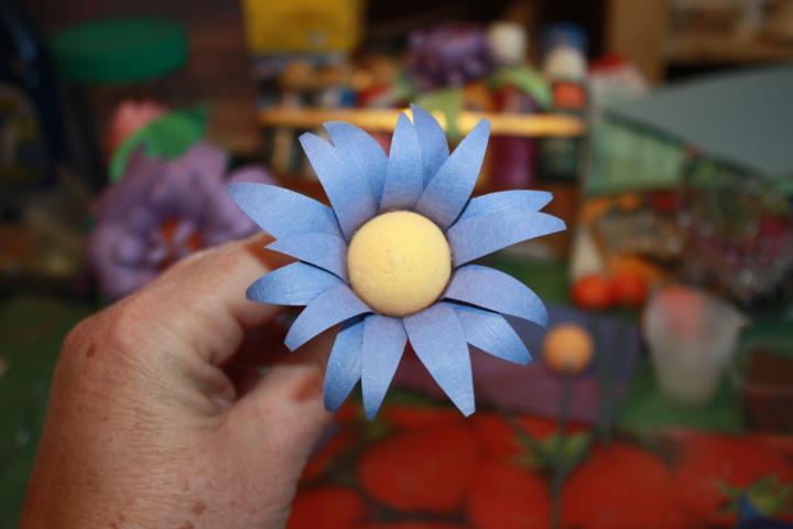 3. Glue one row of petals around the ball,