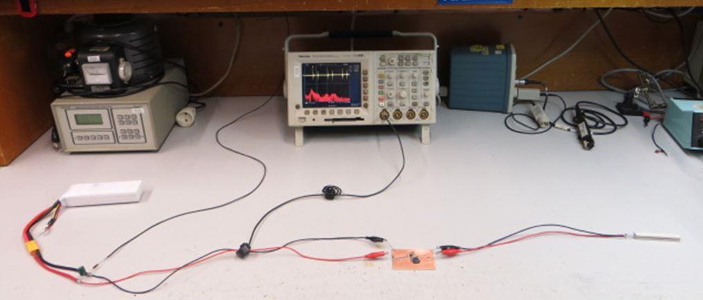 The test measurement setup is shown in figure 14. FIGURE 14 When the board under test is placed on the lab table, the PCB current loops and wiring will radiate HF energy to the environment.
