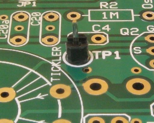 Use discarded resistor leads, forming them into loops. At each of the three groups of pads, install one loop on the top of the board and one loop on the bottom.