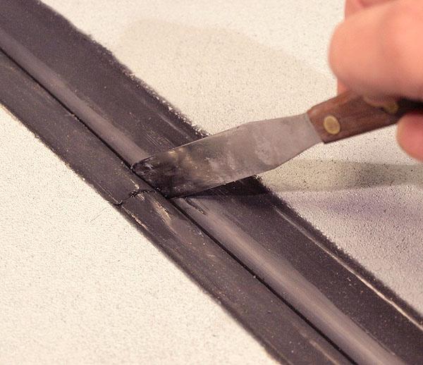 IMPORTANT: Silicone left between the wrinkles of the bellows could constrain movement -- using a caulk knife, remove excess sealant and blend what