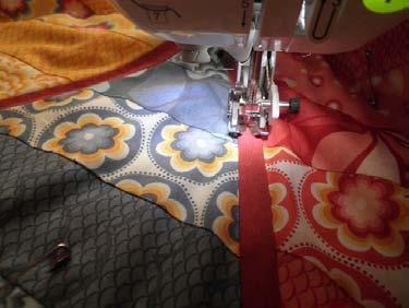 meet and form a V at the raw edges when you are pinning. Quilt top done!