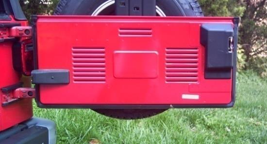 2003-2006 TJ Wrangler: Your tailgate looks like this: The close-up photo below has three black squares representing the approximate positions that the knob pieces for the hangers will install and