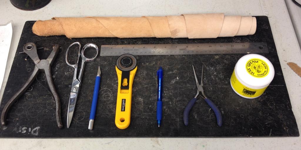 MATERIALS NEEDED: Leather, cutting board, 6-gauge hole puncher, leather scissors, leather cutter