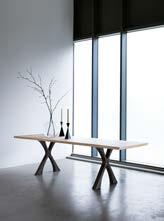 Capricorn dining table Shown here finished in Bronze with 12mm opti-clear glass. 220x120 x H75cm Other sizes to order.