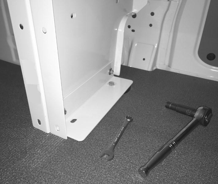 Using the 10 mm socket, a driver and the 10 mm wrench, loosely attach the right end panel to the Front Mounting Foot with two M6-1.
