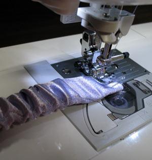 Tack the elastic and satin together on each end by sewing a straight