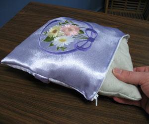 Slip the pillow form inside the cover and zip it up.