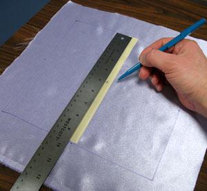 For the pillow cover, draw a 9 1/2 x 9 1/2 inch square on the satin fabric, leaving a couple of inches of excess around the shape.